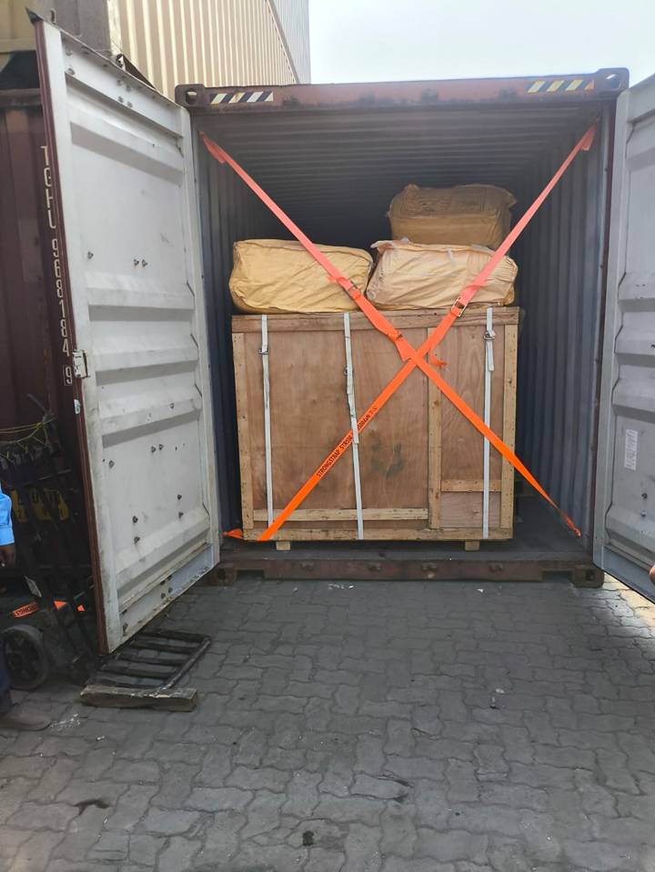 Crated cargo secured inside a shipping container